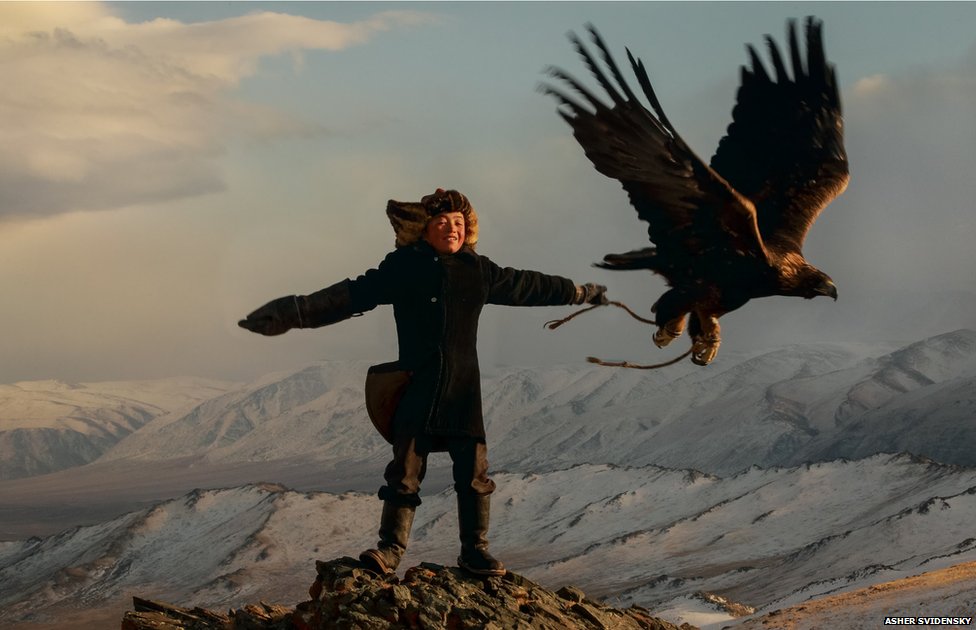 Eagle hunter Ashol-Pan with her Golden Eagle.